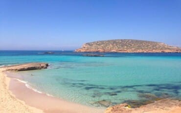 San Antonio, Ibiza. With three beautiful beach areas to explore and a dazzling backdrop, Cala Conta always feels like a discovery.